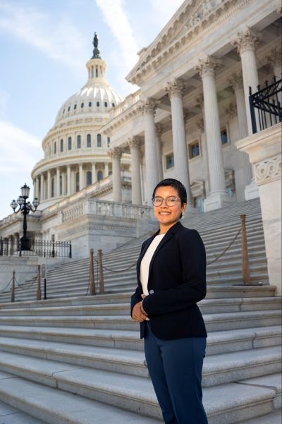 woman standing on steps of the building