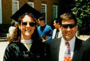 Michelle outside class in cap and gown