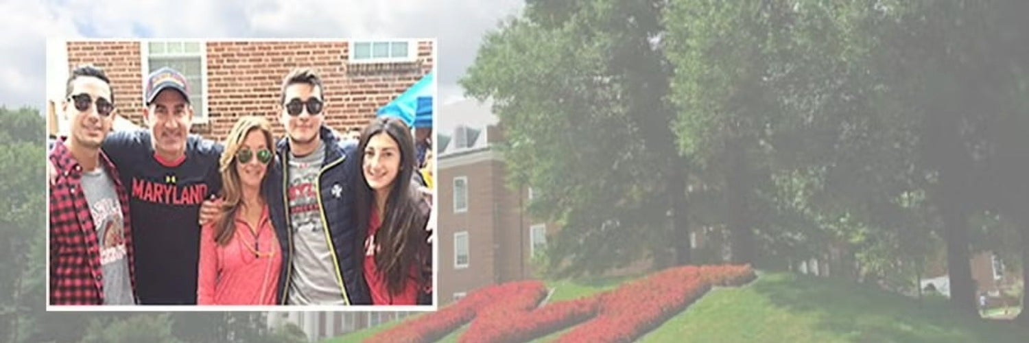  The Eisner family of five posing in front of a brick building.