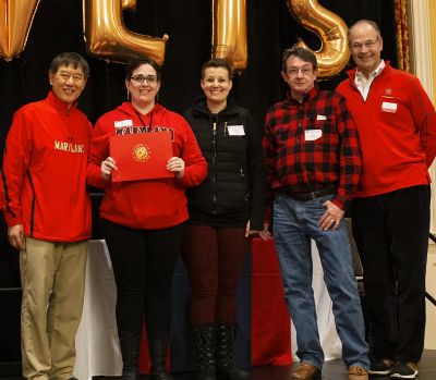 Elizabeth received award in a group photo 