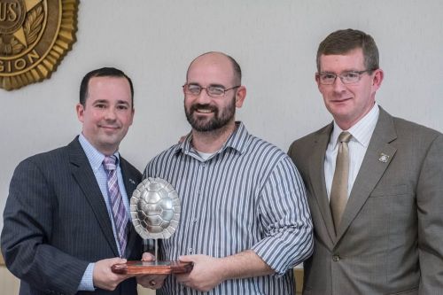 group photo of Jason getting award