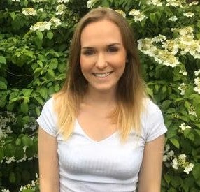 woman in front of green plants