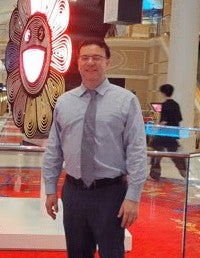 man in shirt and tie, standing 