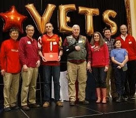 Shawn in group photo accepting award.