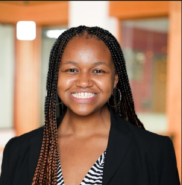 Woman smiling and wearing a suit