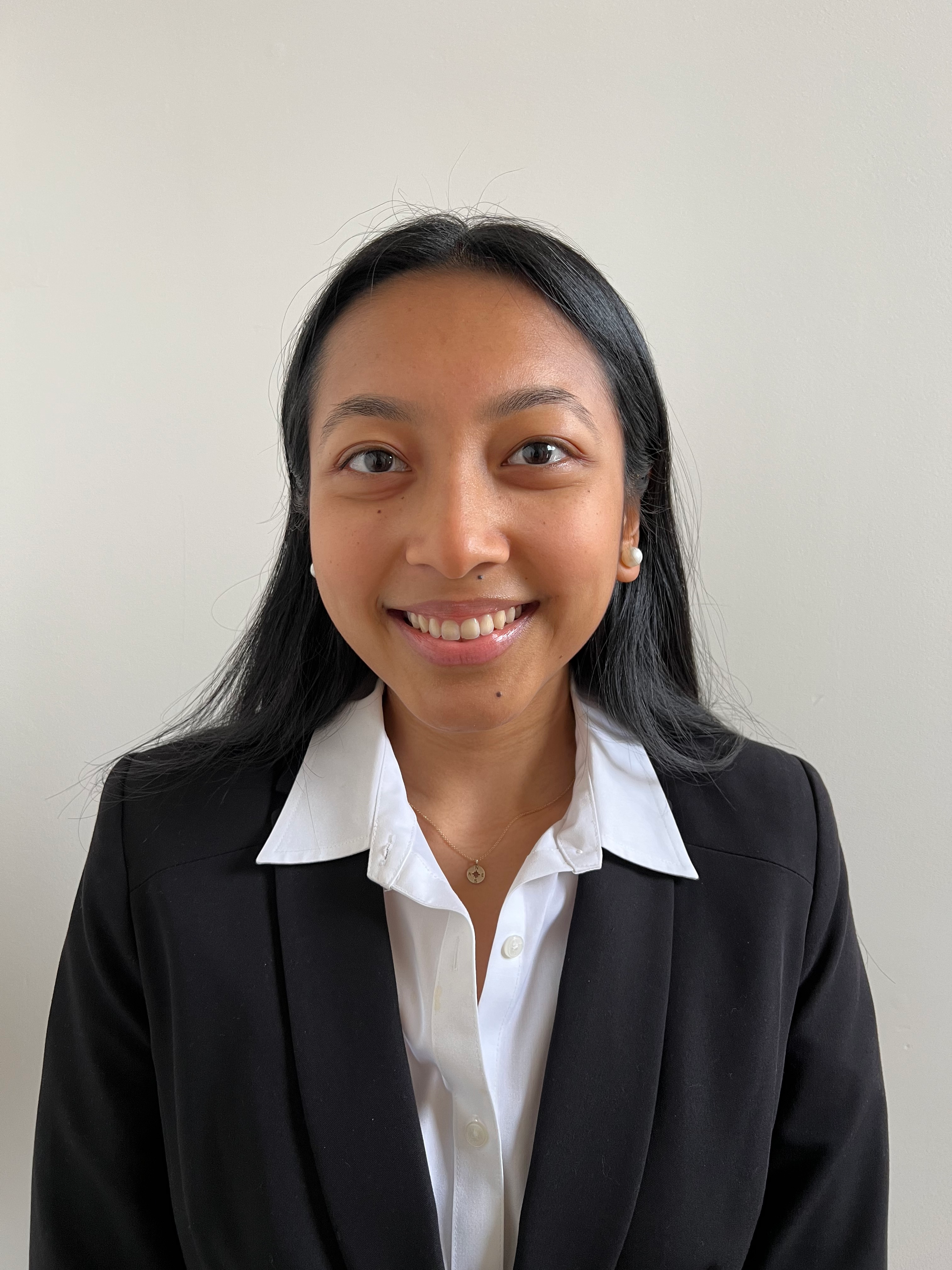 Young woman smiling in a suit
