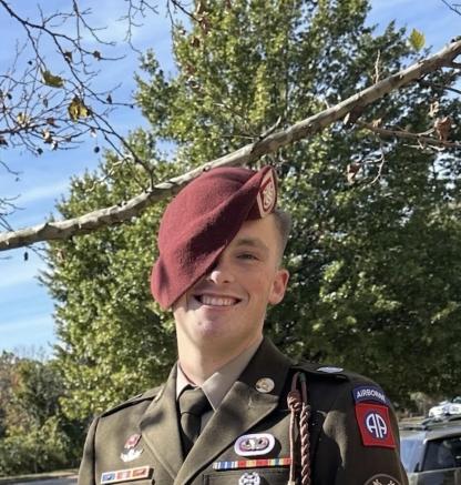 man wearing military uniform and beret