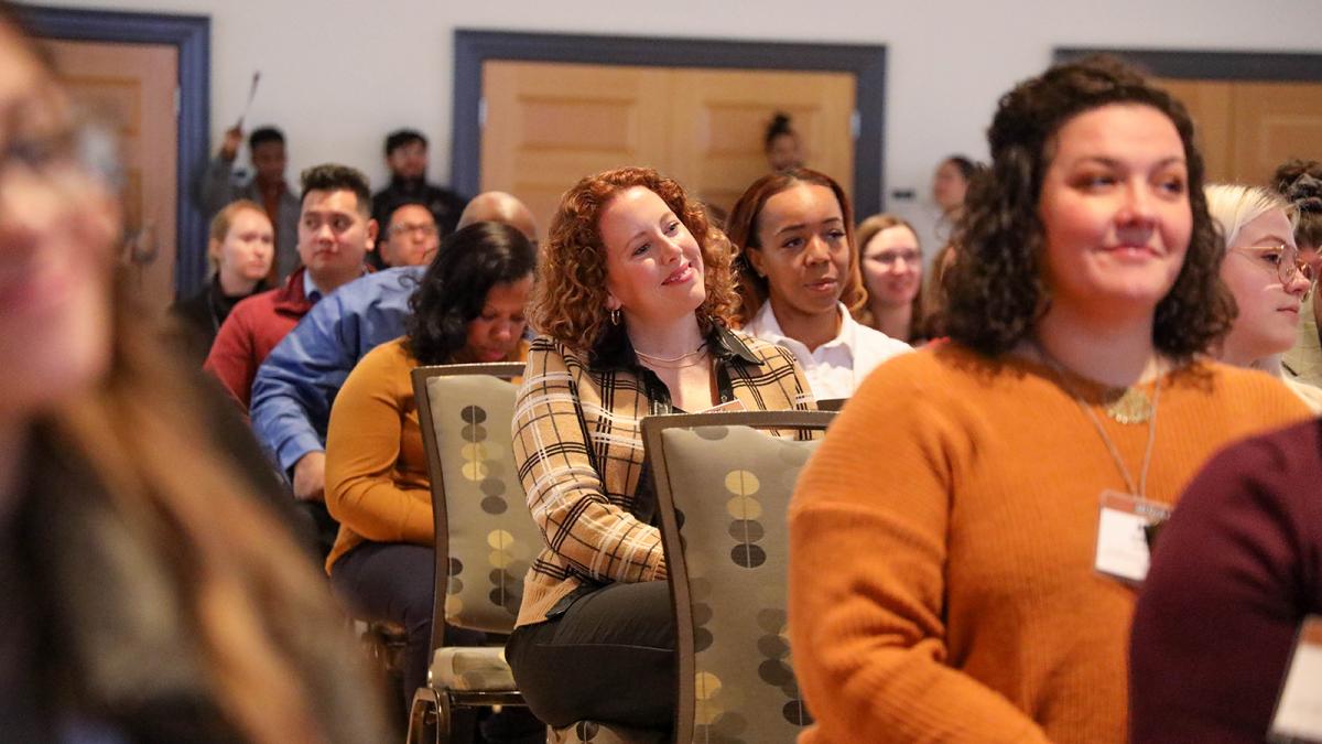 Staff listen to a speaker
