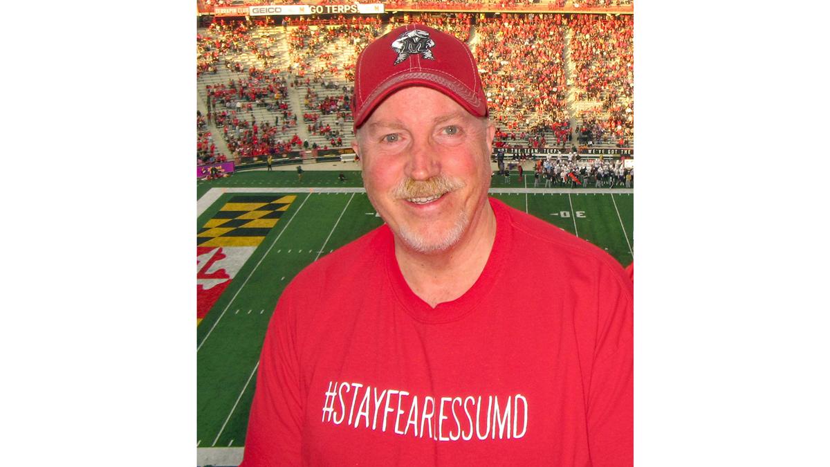 Rocky Lopes in front of the UMD football field. 