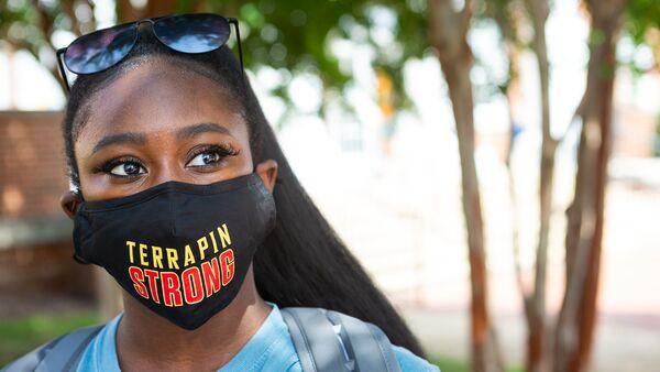 Female student wearing a Terrapin Strong mask