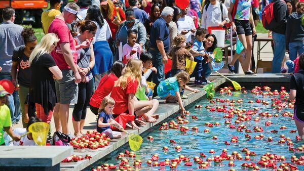 Maryland day festivities. Kids, parents, and students gathered around the reflecting pool