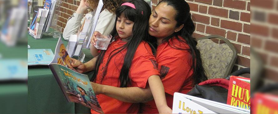 A mentor guiding a child through reading a picture book