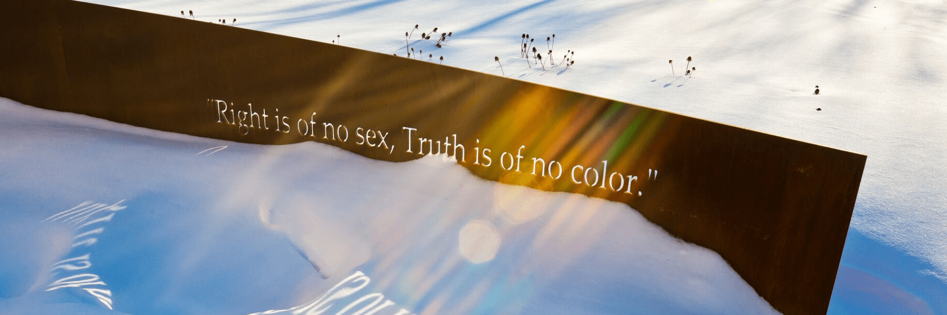 Sculpture with text, "Right is of no sex. Truth is of no color."