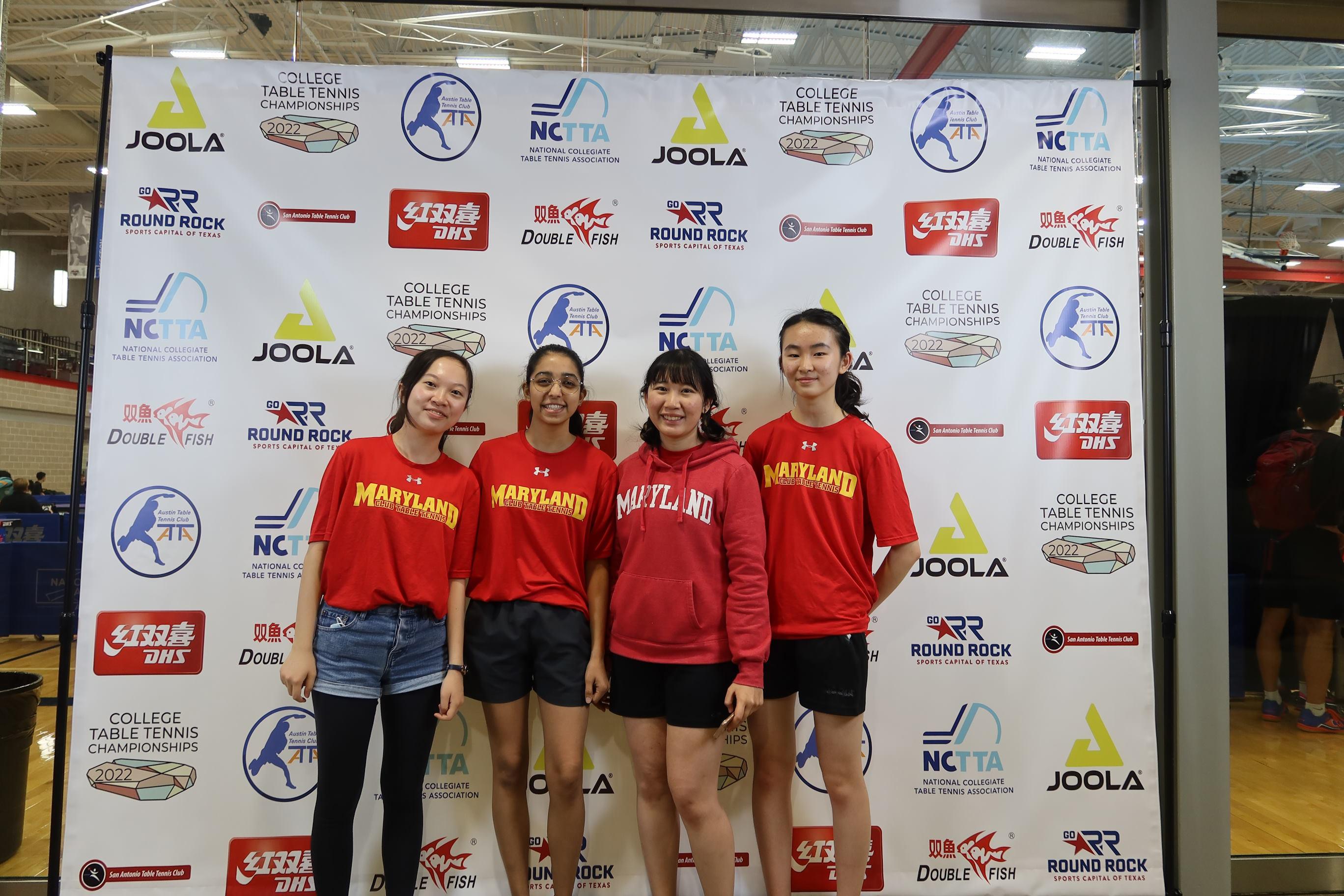 Members of the table tennis club standing together for a photo.