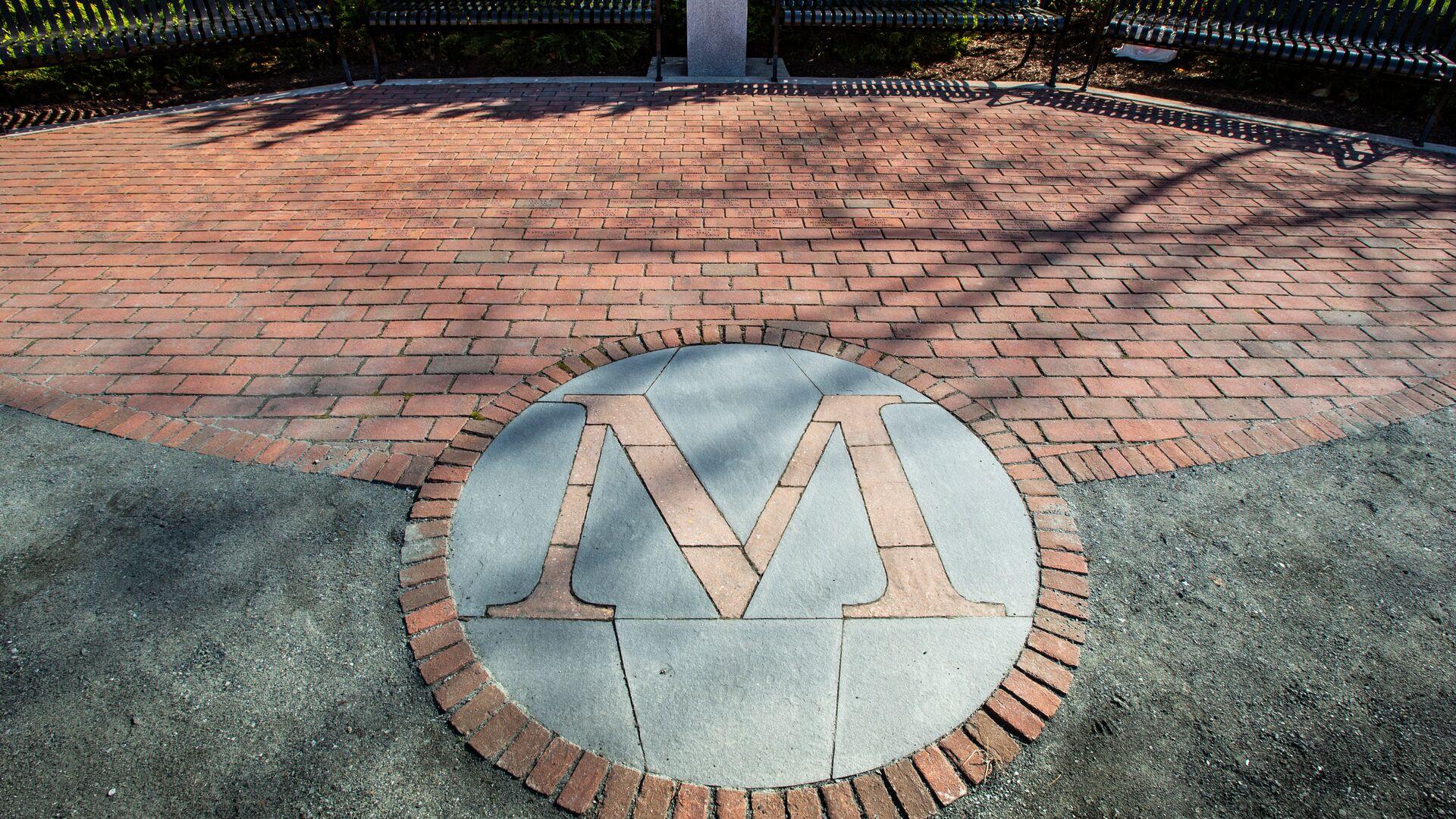 Fraternity Row Garden brick walkway with the University M inlaid in brick