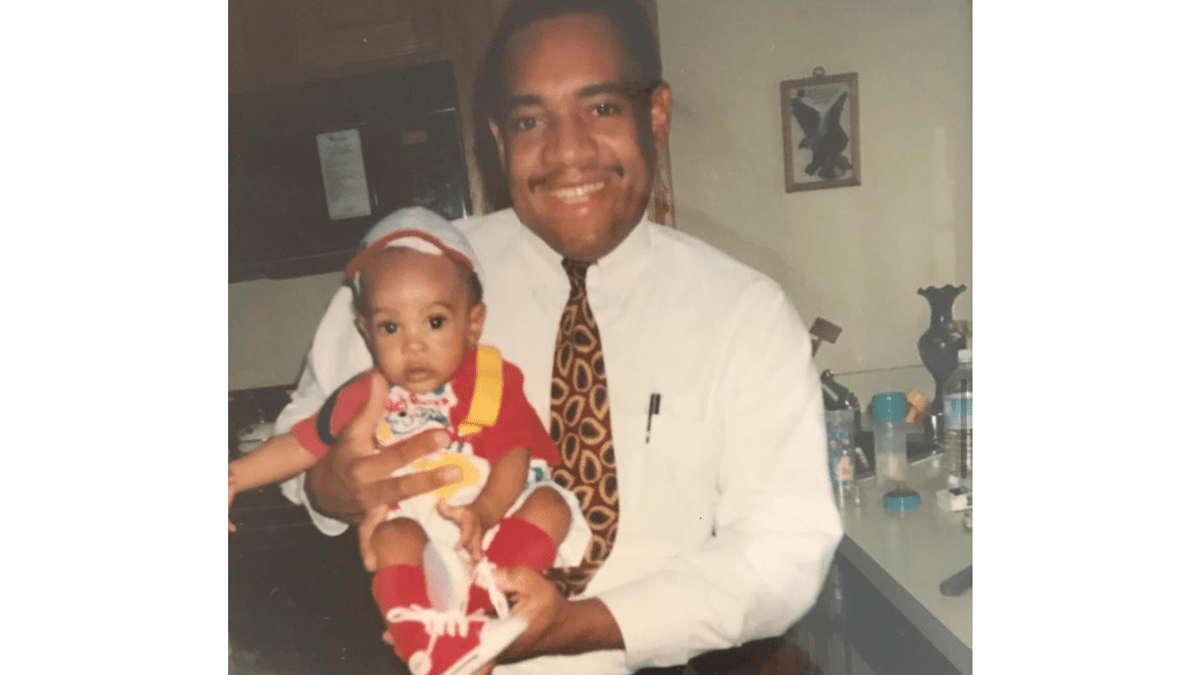 Leonard Riggs holding his son, Chris Riggs, as a baby.