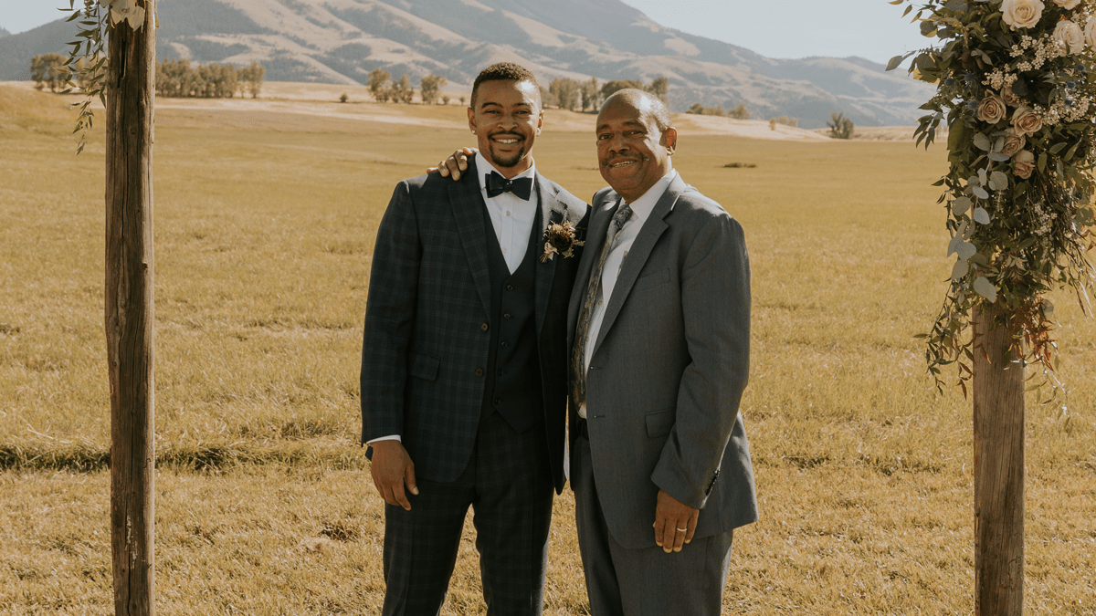 Chris and Leonard Riggs wearing suits at a wedding ceremony. 