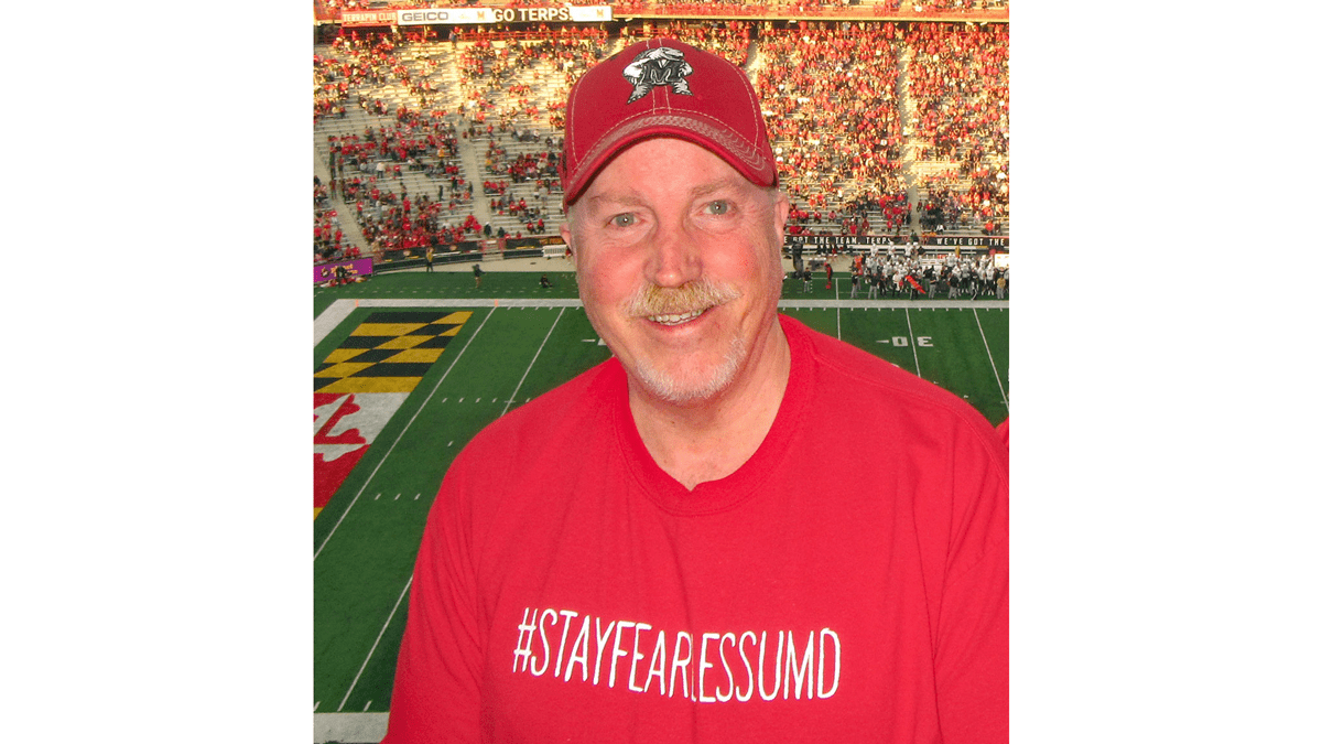 Rocky Lopes in front of the UMD football field. 