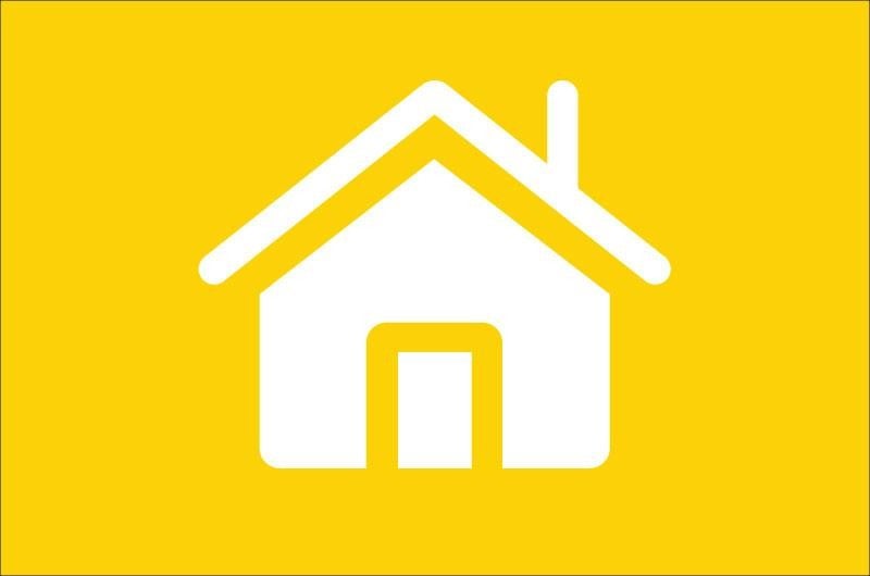 icon of a house in white on a gold background